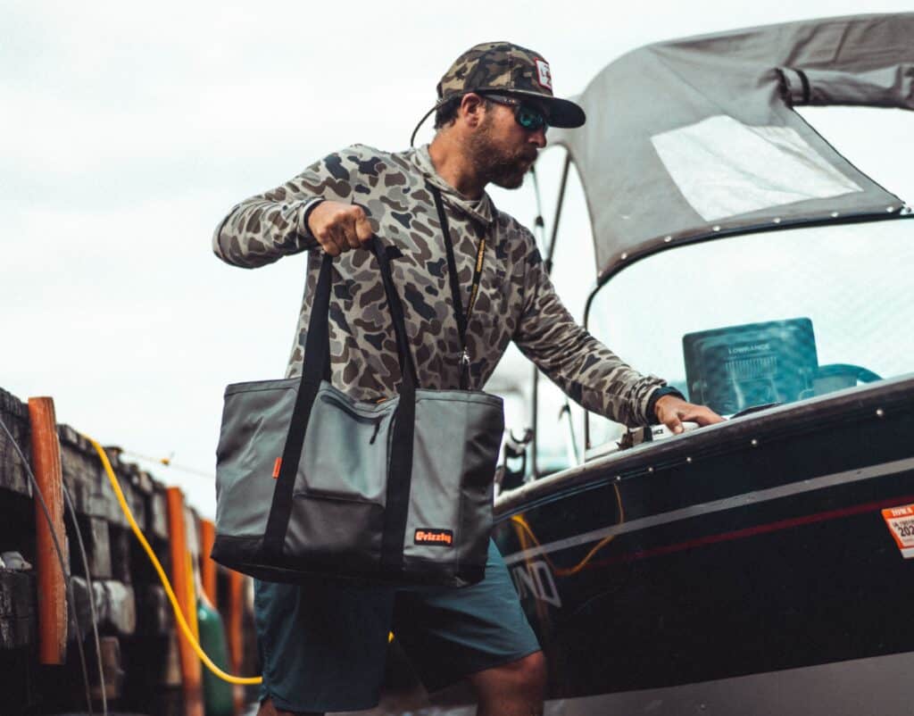 Man Carrying Drifter Carryall Cooler Bag Getting Into Boat