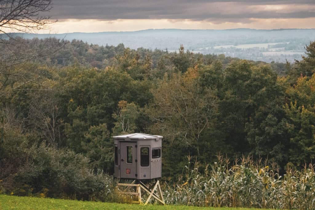 Halloween Deer Hunting Grizzly Elevated Hunting Blind Overlooking A Valley Of Trees With Fall Colors