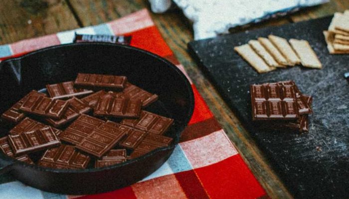 cast iron camping recipes melting hershey chocolate bars in skillet